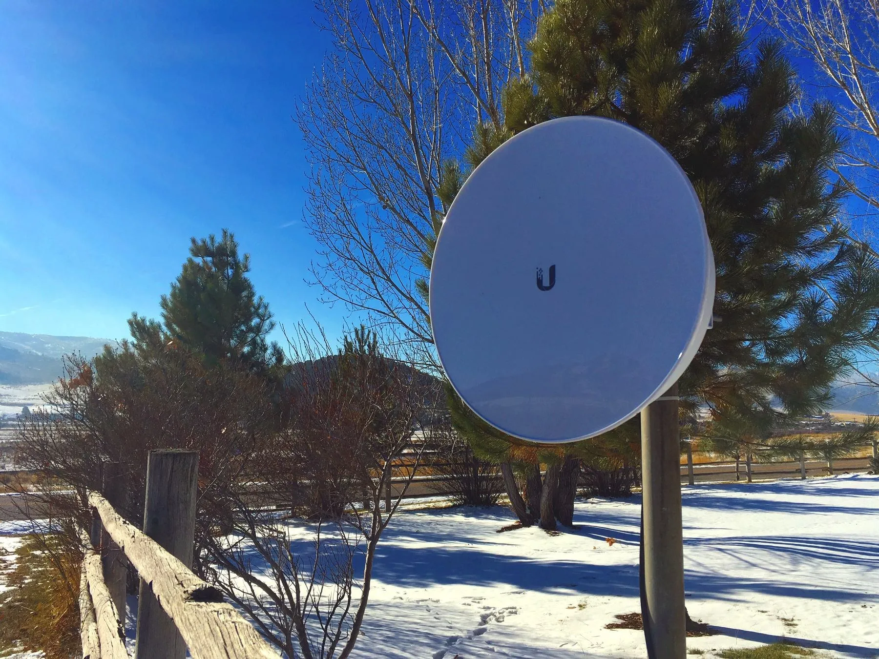 A Lavalink dish on its mount after a December snowfall, the valley behind it