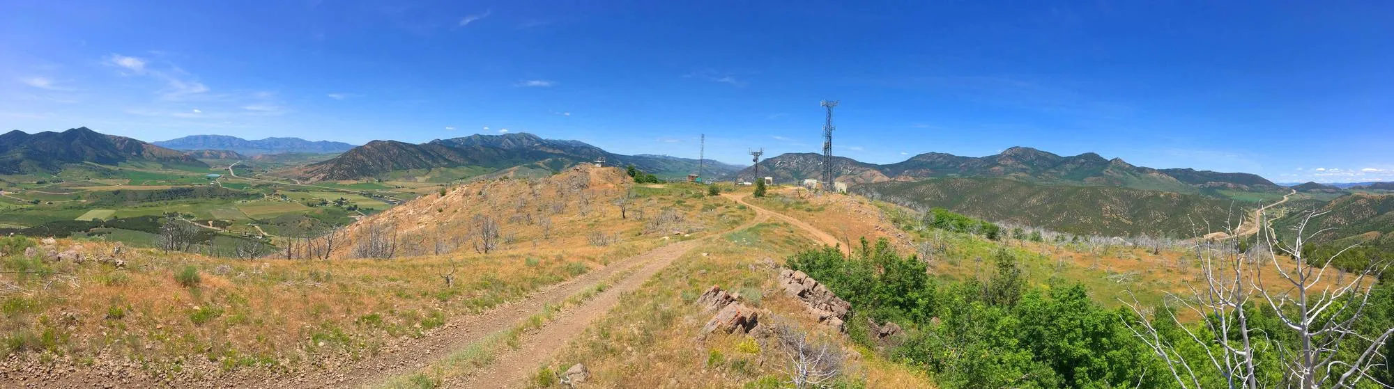 The ridge above Lava Hot Springs with radio towers along a two-track road, mountains in every direction